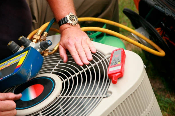 Air conditioner condenser inspection with refrigerant hoses and a digital thermometer